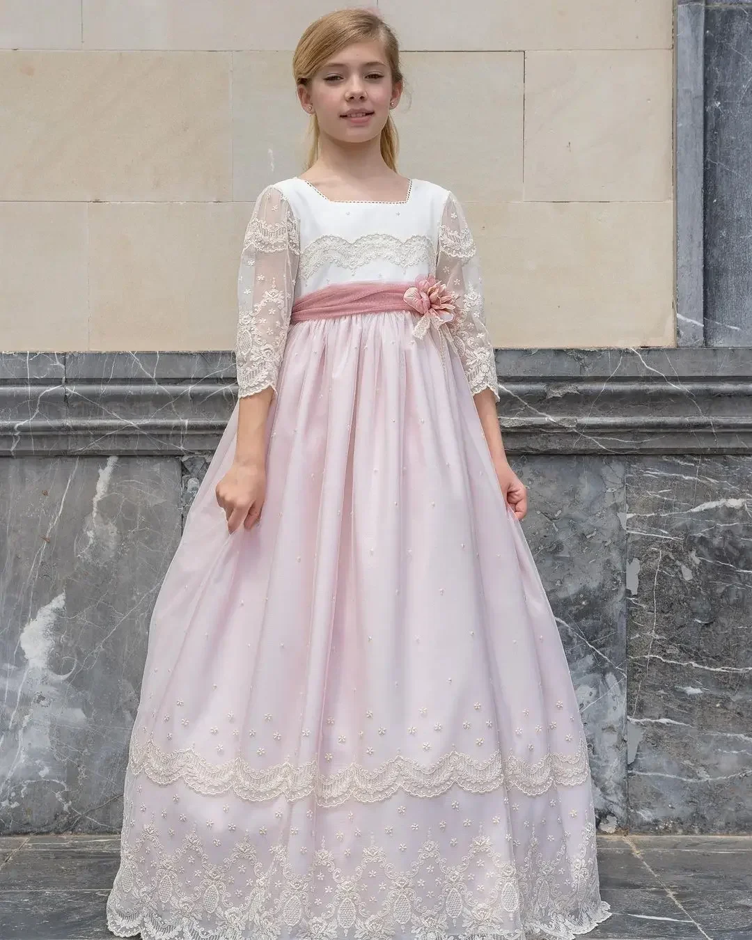 Long Sleeved Communion Dress with a Maxi and Flowing Multi-layer Skirt Floral Details in the Middle Pink Ribbon Belt