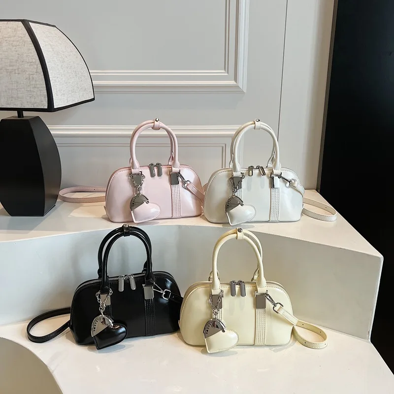 

Новая винтажная женская сумка через плечо 2025 года, текстурированная сумка через плечо, просторная сумка в стиле ретро, универсальная и шикарная веганская кожа