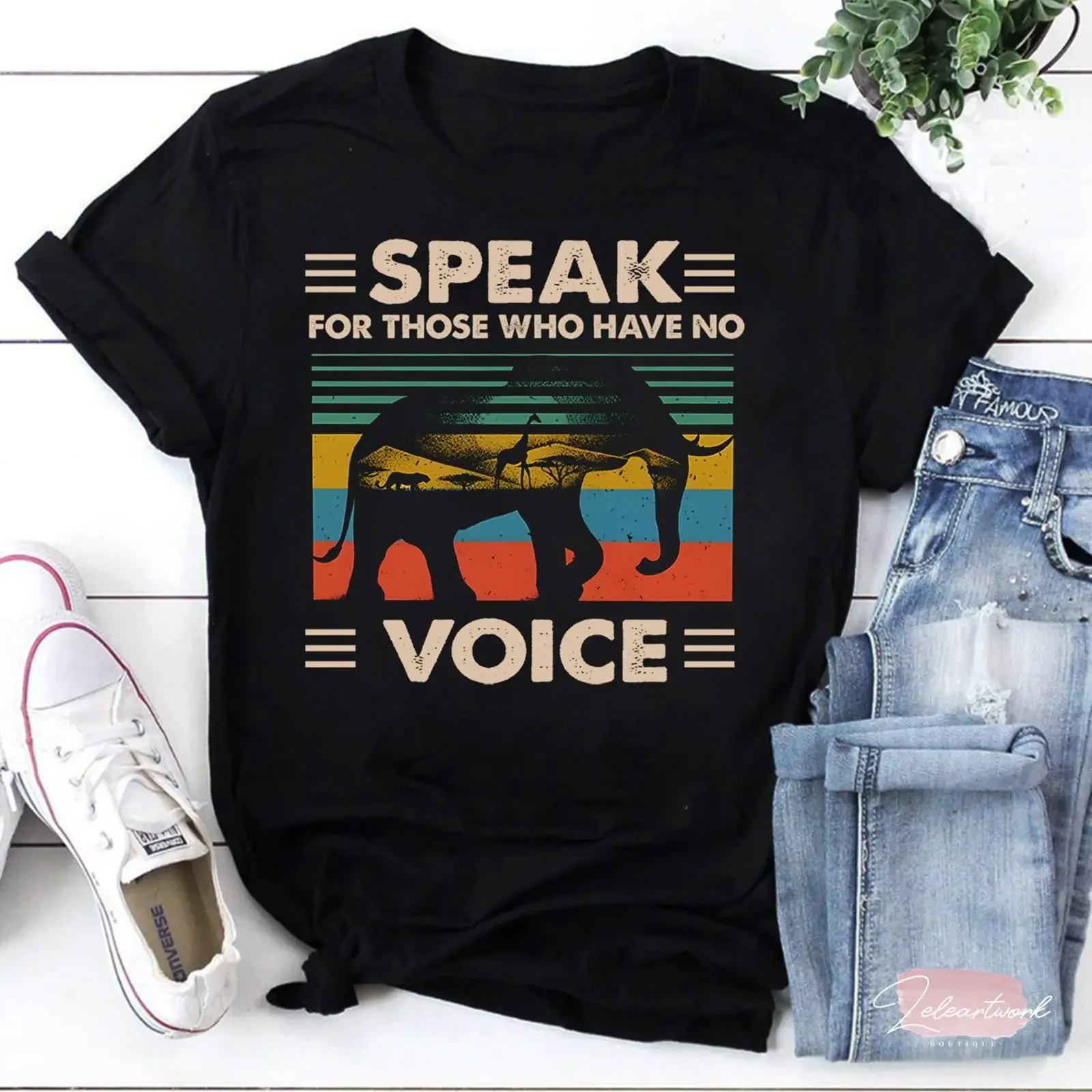 May include Black t shirt with a vintage style graphic of an elephant the text Speak for those who have no voice vintage homme