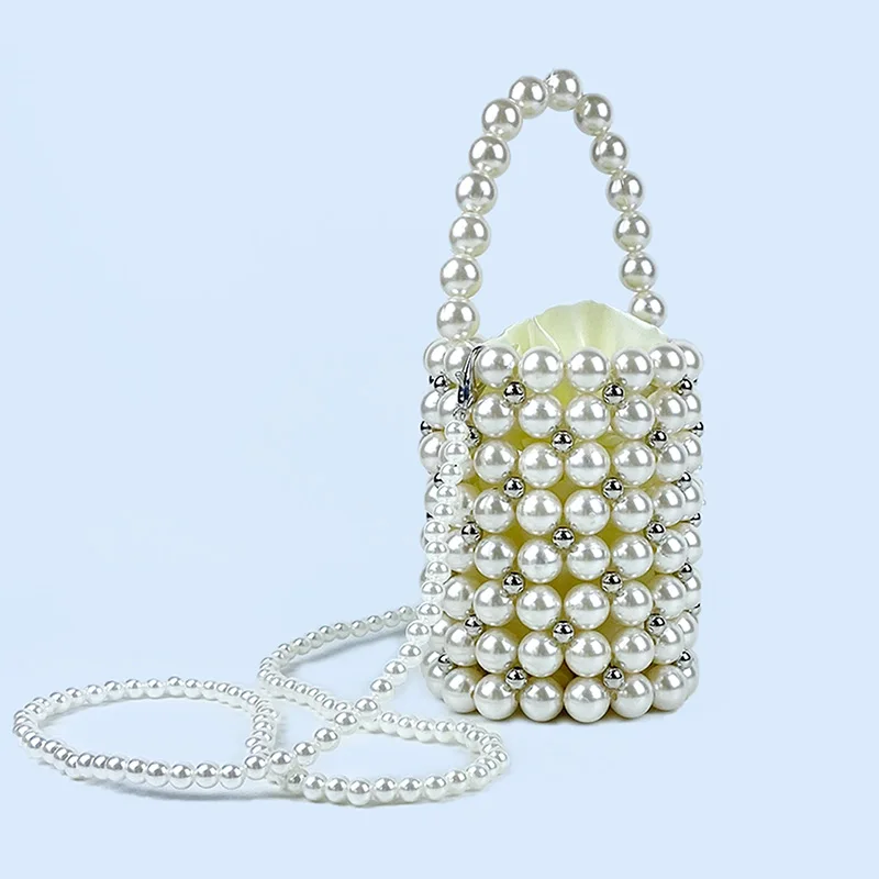 Hollow handmade woven beaded pearl bag, round bucket bag, hand-held fairy bag, paired with skirt small bag