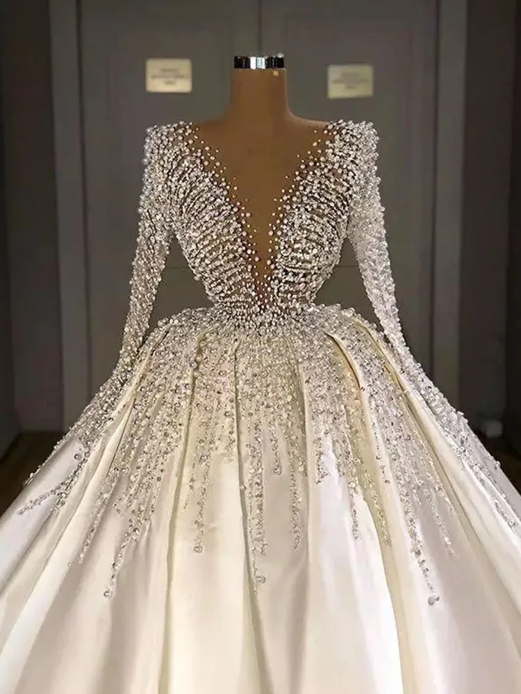 Luxury Pearls Satin Wedding Dresses for Bride 2023 Mermaid Beads Long Sleeves V Neck Puffy Skirt Saudi Arabia Bridal Gowns