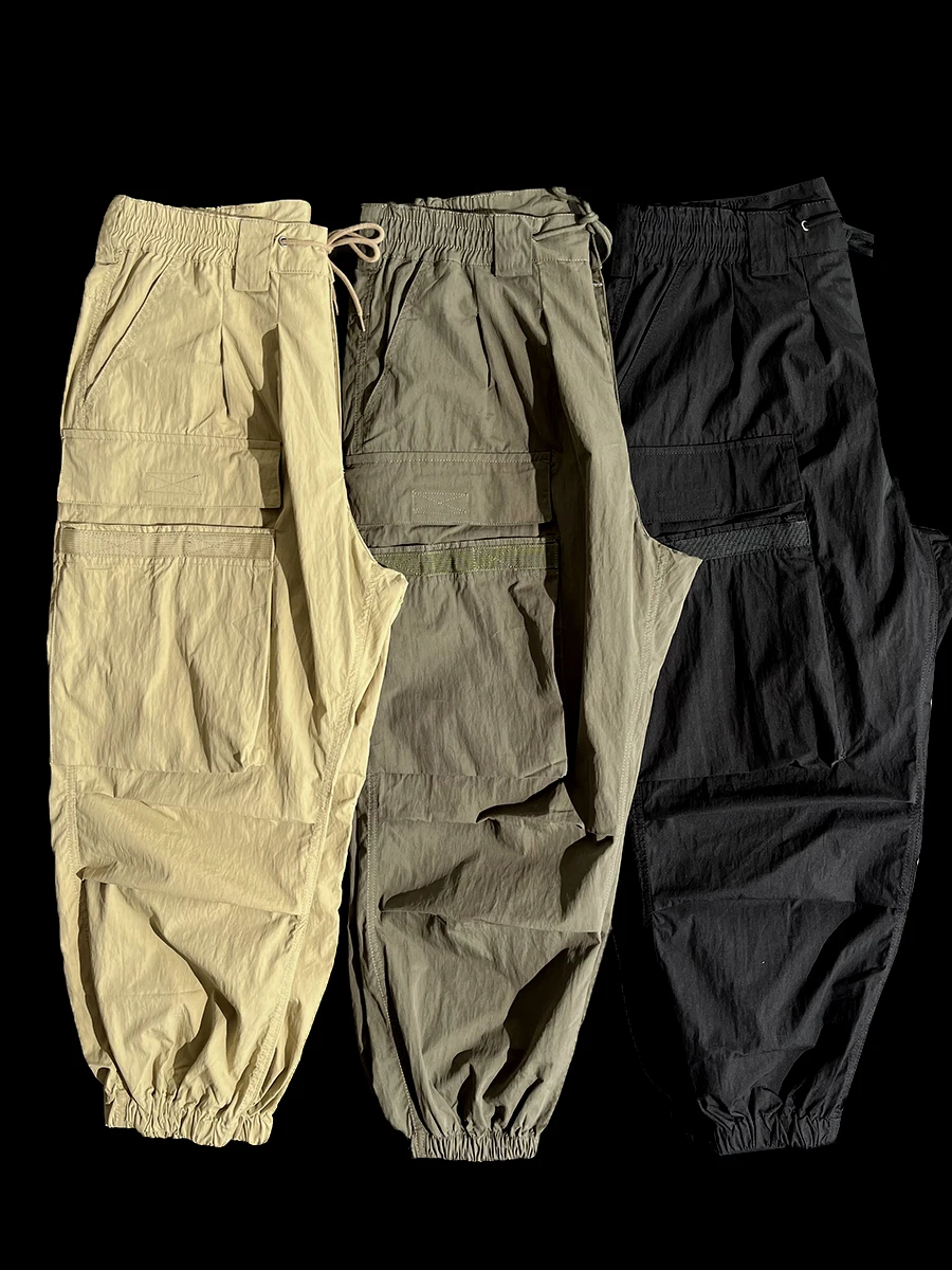 

Водонепроницаемые мужские повседневные брюки-карго с множеством карманов, свободного кроя, молодежные, из полиэфирного волокна, осенне-весенние, модные, брендовые