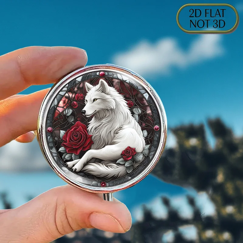 A Flat, Portable, Round Metal Pill Box Decorated with a White Wolf and Rose Stained Glass Design, Ideal for Organizing Daily Medication. This Elegant and Compact Storage Box Is Also Perfect for Storing Vitamins, Small Accessories, or Change.