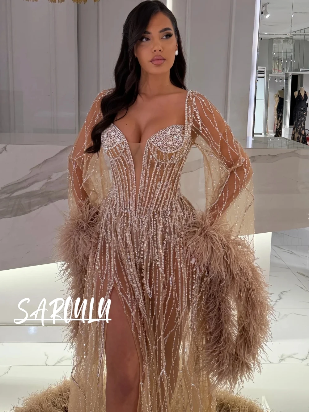 

Luxury Champagne Sheer Long Sleeve Mermaid Evening Gown Crystal Sequined Feather Ostrich Trim High Slit Trailing Formal Dress