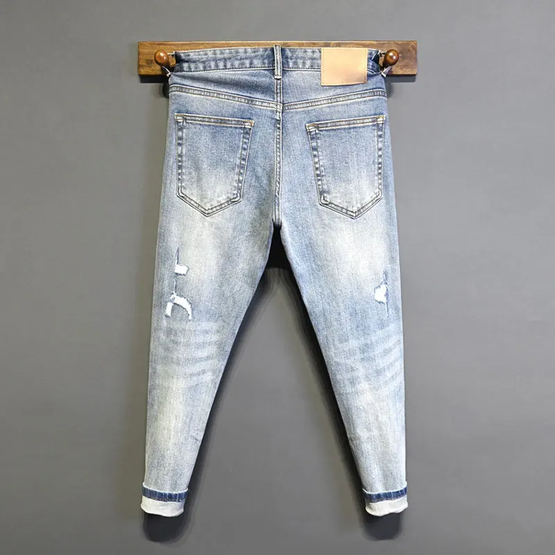 High Street Fashion pria Jeans Retro biru muda melar Skinny Fit robek Jeans Pria dilukis desainer Hip Hop celana Denim Hombre