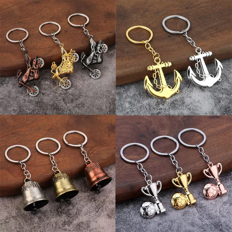 

100pcs/Lot Metal Ghost Head Robot Keychain Cartoon Motorcycle Keyring Championship Trophy Key Chains Boat Anchor Bell Key Rings