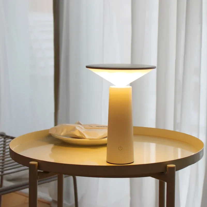 Nordic minimalist style table lamp with USB charging function for creative decoration of dining room and bedside.