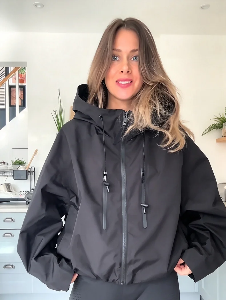 Women Oversized Hooded Rain Jacket Waterproof Wind Resistant Full Zip Multi Zipper Pockets Drawstring Casual Outdoor Windbreaker