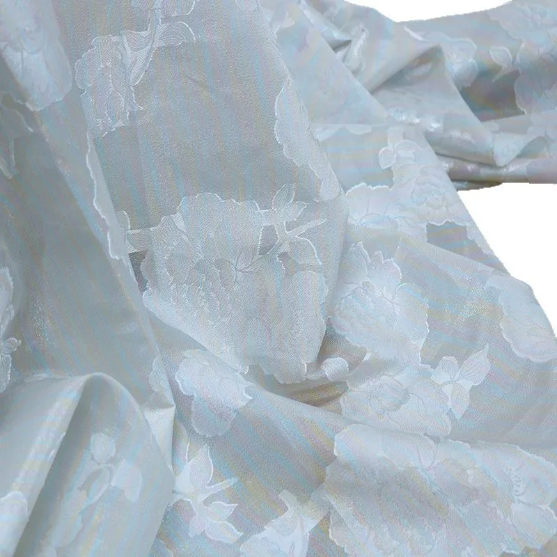 The iridescent and flowing light silk human colored leather blended jacquard fabric has  a versatile style