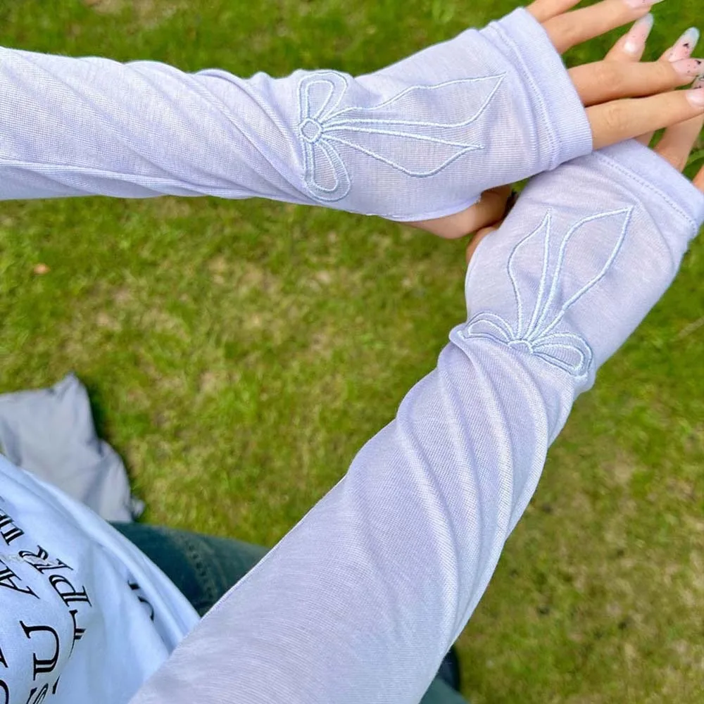 Maniche di ghiaccio alla moda con fiocco dolce ricamate maniche lunghe traspiranti stile coreano sottili coperture per protezione solare per braccio ad asciugatura rapida Sport