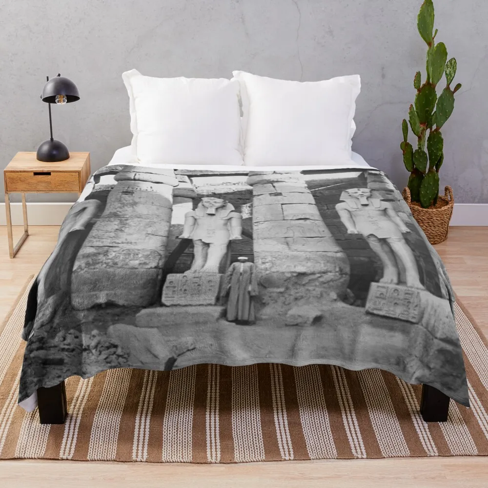 Ancient Egypt, Pharoah Rameses Portrait Statues, Luxor, 1922, black and white photographic art print by Elmendorf  Throw Blanket