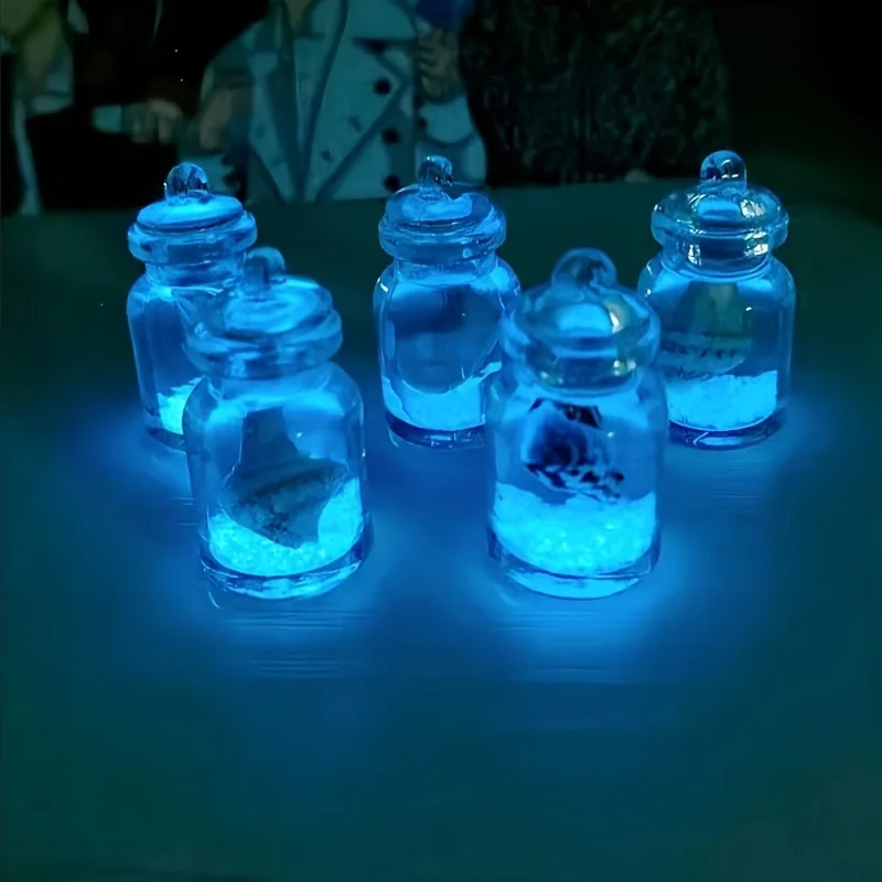 محارات مضيئة في زجاجات زجاجية شفافة، زجاجة انجراف على شكل محارة نجم البحر المحيطي مناسبة لعيد الميلاد ورأس السنة الجديدة