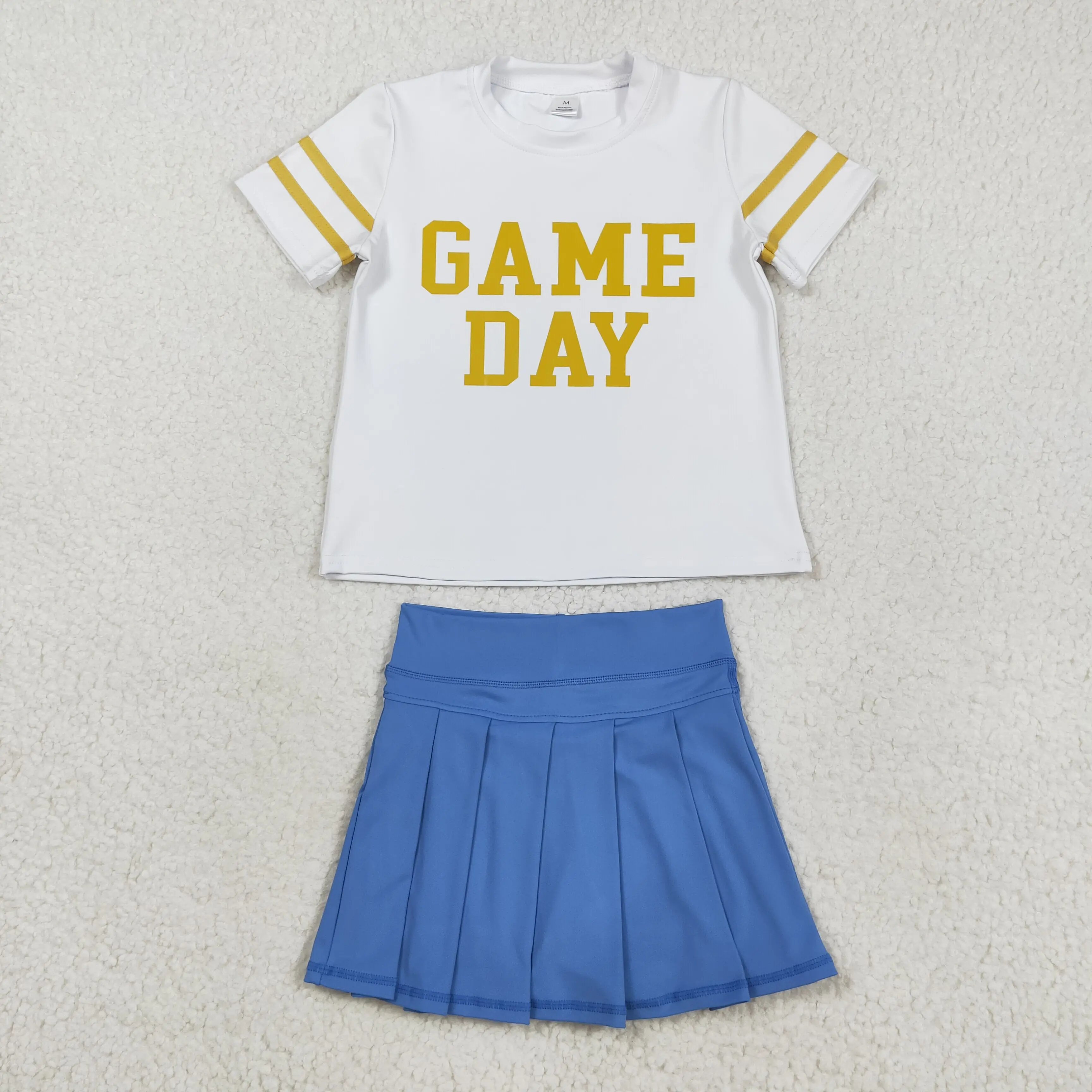 

Baby Girls' Vinyl Gold Game Day Top with Blue Pleated Skorts Short Sleeve Active Team Set for Toddlers
