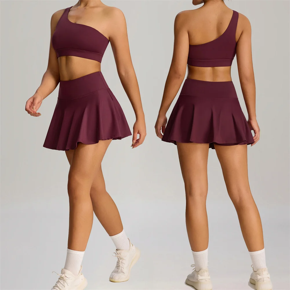 

2 шт., бюстгальтер на одно плечо, комплект для йоги, женская теннисная плиссированная юбка, антишорты, карман, тренажерный зал, спорт, бадминтон, тренировки, активная одежда