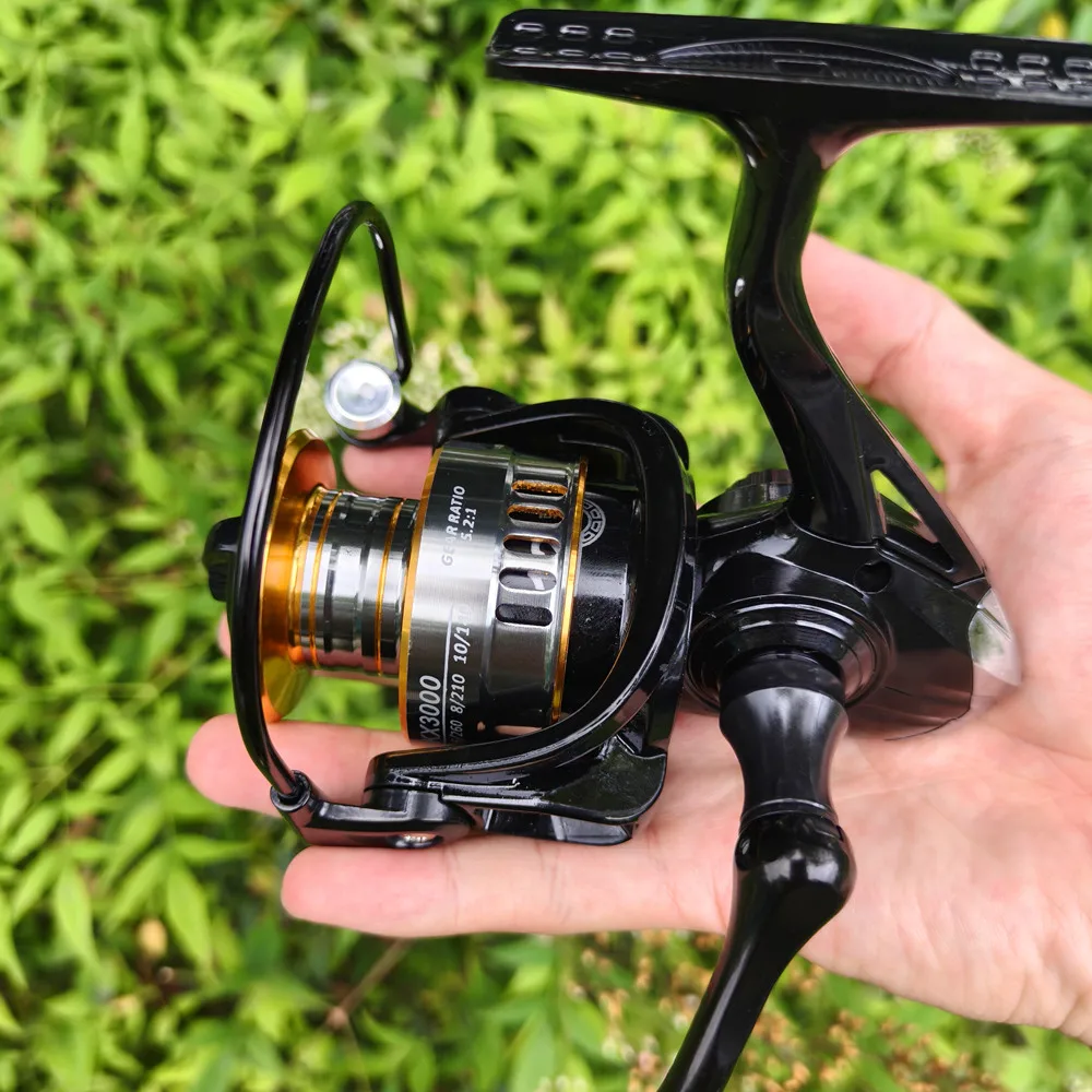Carrete de pesca giratorio serie 1000-7000, carrete de Metal ultraligero súper potente con mango de Eva, carretes giratorios para agua salada