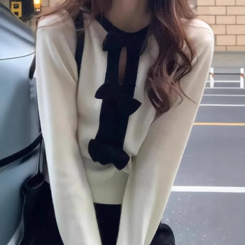 

French-style white bow-knot hollow-out long-sleeve knitted base shirt women, autumn and winter sweater, high-end and elegant