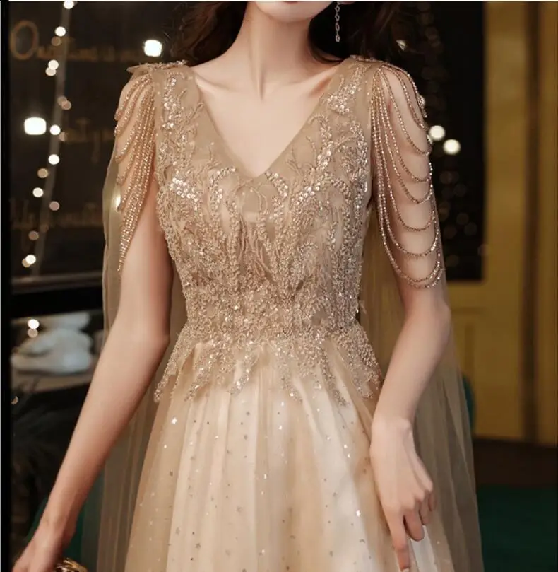 

Champagne Gold Evening Dresses With Cape A Line New Sexy V-neck A-line Shiny Luxury Beading Shawl Formal Celebrity Prom Gowns