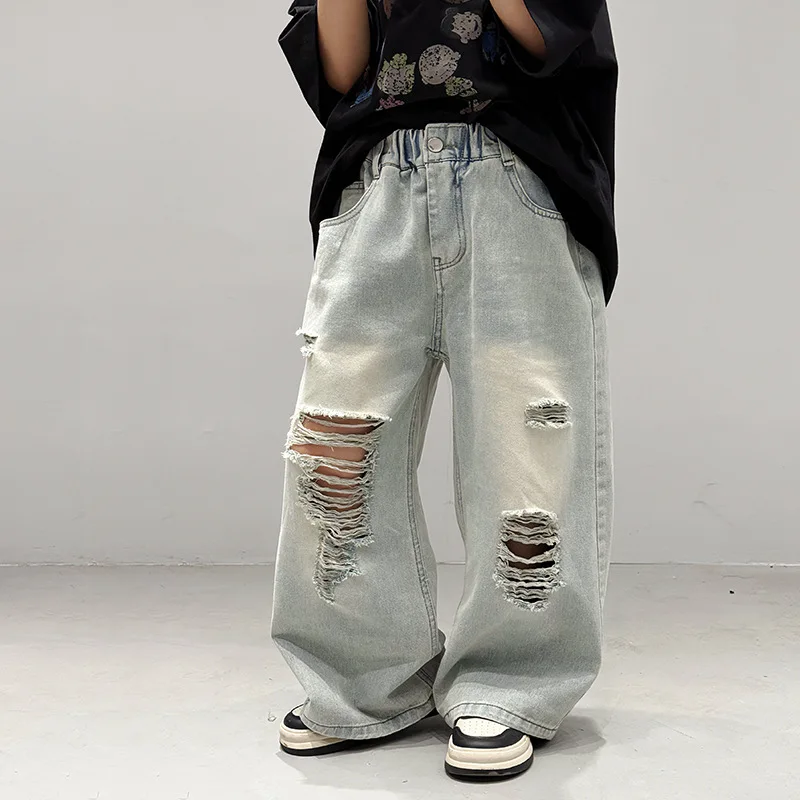 Children's pants 2025 spring new boys and girls spring casual loose ripped solid color jeans