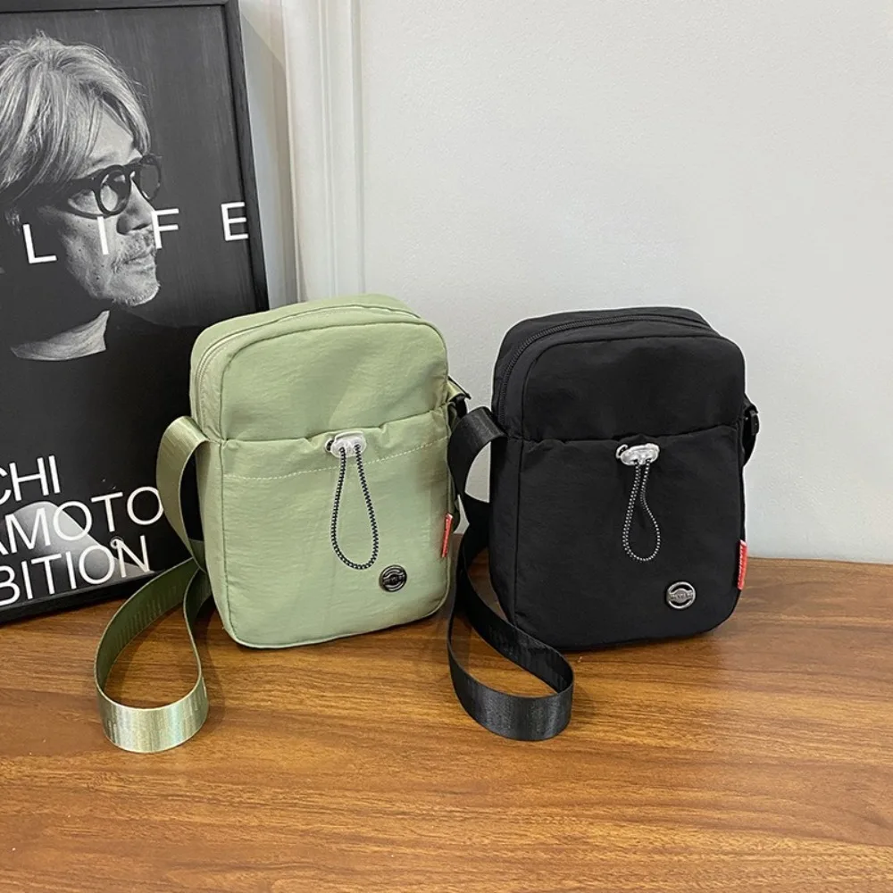 

Solid Color Drawstring Crossbody Bag Korean style Nylon Nylon Shoulder Bag Large Opening Waterproof Water Cup Bag Women