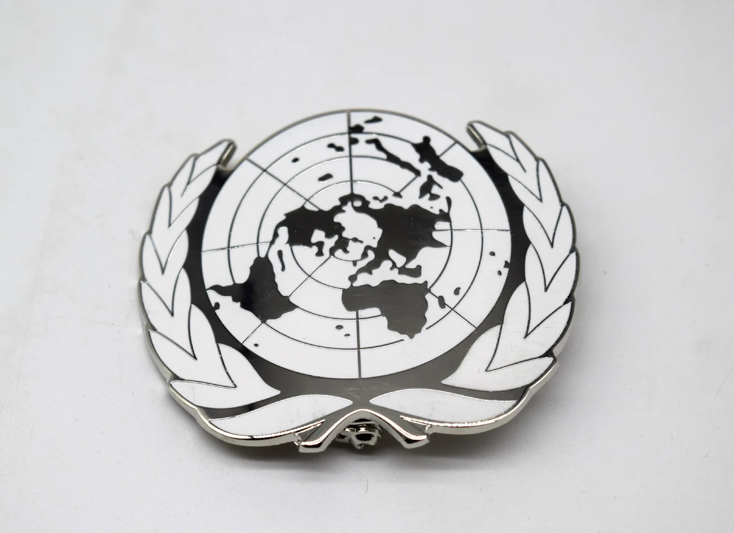 

Значок шляпы UN BLUE BERET Значок UN Siliver