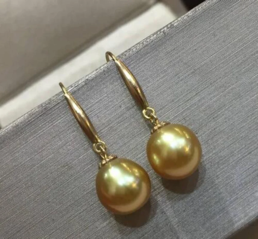 

Pair of 10mm natural south sea gold round pearl earring