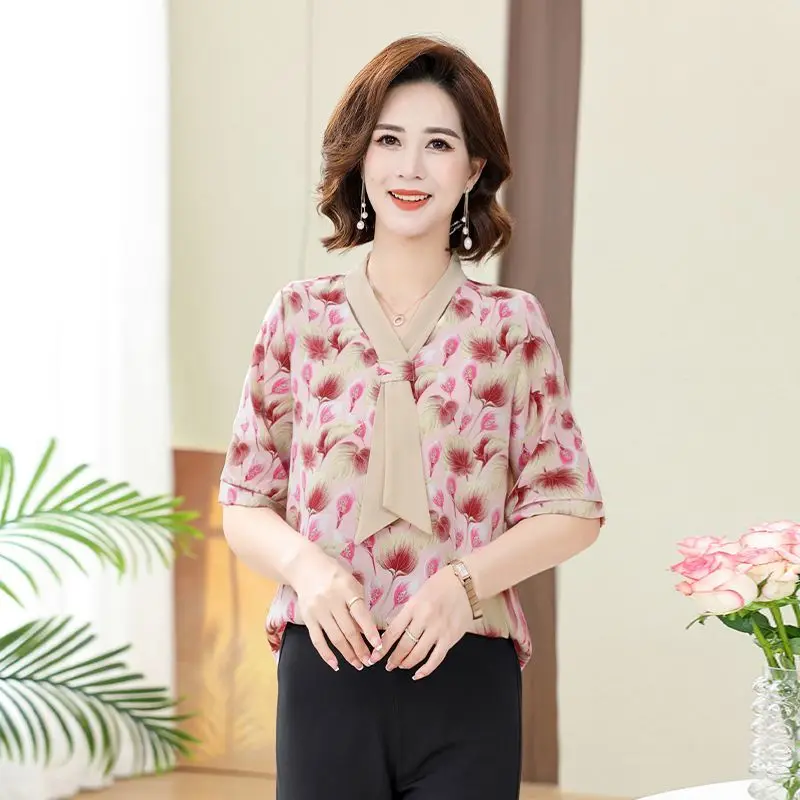 T-shirt a maniche lunghe con scollo a V alla moda con stelle filanti stampate allentate da donna in chiffon