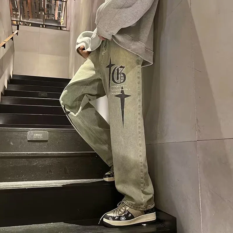 2025 ขายร้อน Distressed พิมพ์กางเกงยีนส์ผู้ชายใหม่หลวม Bell Bottoms อินเทรนด์ Hip Hop ตรงกางเกงสบายๆสไตล์อเมริกันกางเกงยีนส์ผู้ชาย