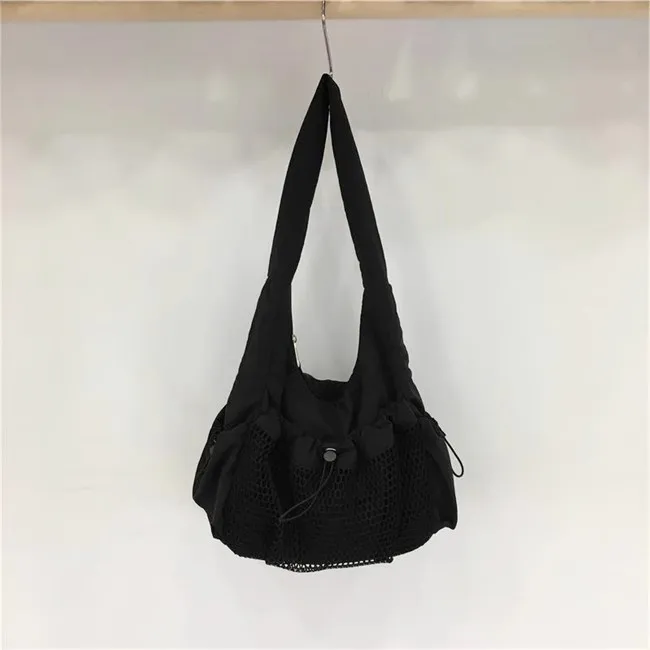 Bolso de lona de nailon con malla hueca para mujer, bolsa de mano informal de marca de moda, bolso de un hombro para las axilas, bolsos de diseñador de lujo, novedad de verano 2024