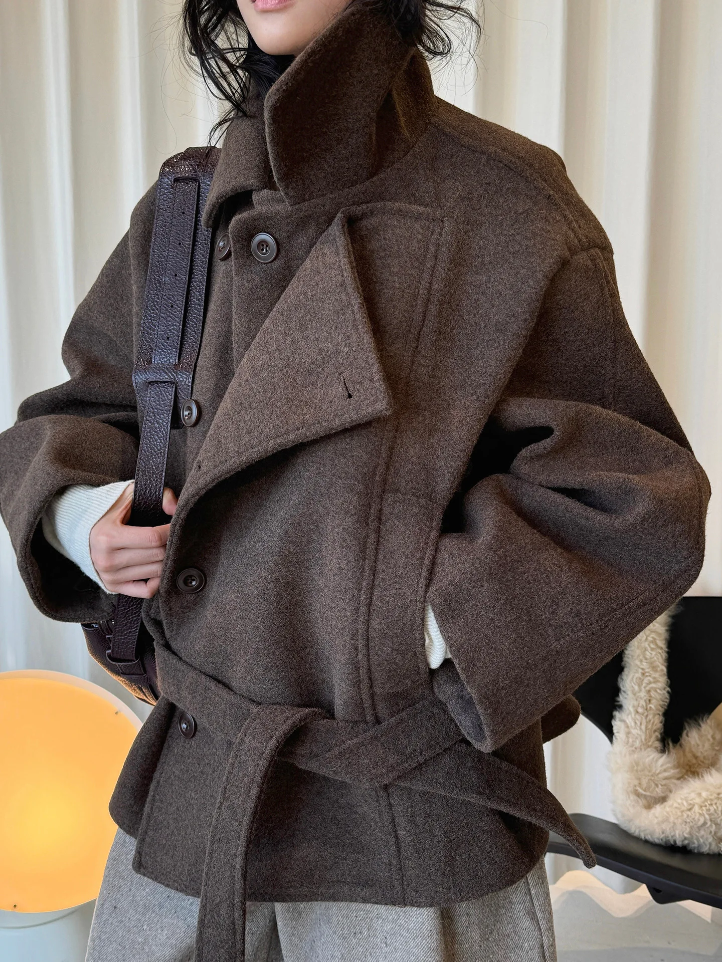 

Winter Korean fashion design style with a single-sided lapel and waist belt, a double-layer placket warm coat for women