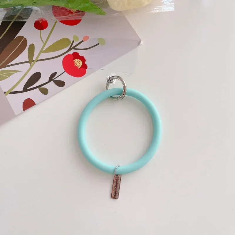 スポーツ、携帯電話ストラップ、女性のバングル、バックパックの装飾、創造性、車のキー、損失防止、男の子のためのシリコンソーノピールリストバンド