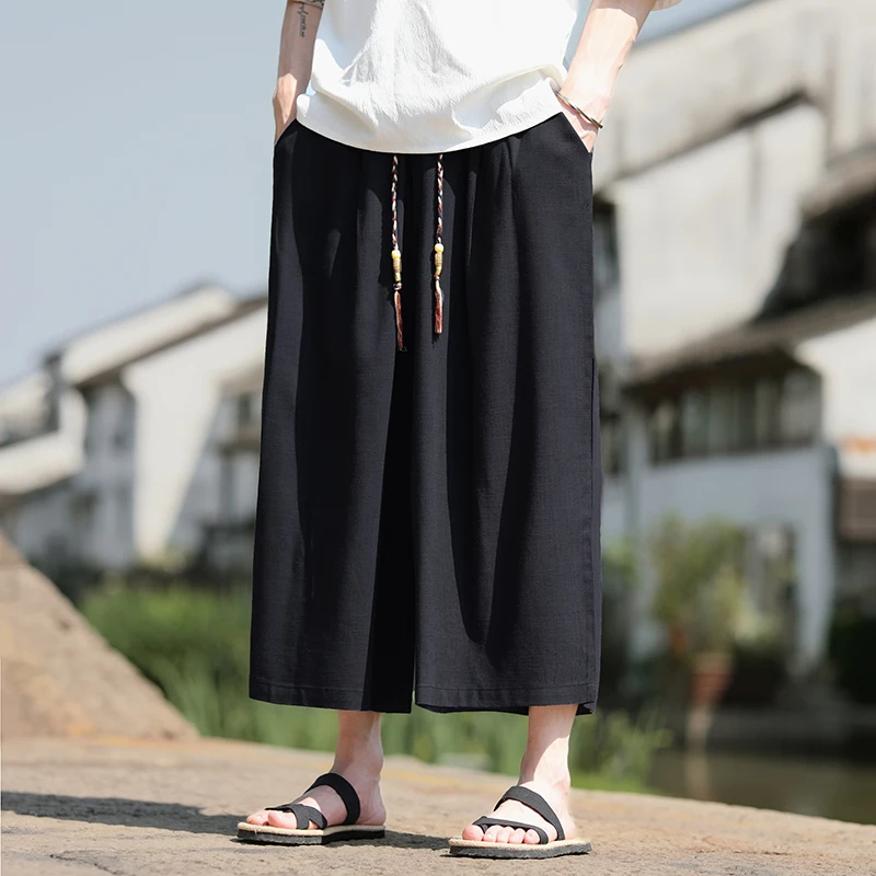 Pantaloncini larghi da uomo Pantaloni casual traspiranti estivi Gamba larga in cotone di lino Taglie forti 5XL Pantaloni Harajuku comodi da esterno da uomo