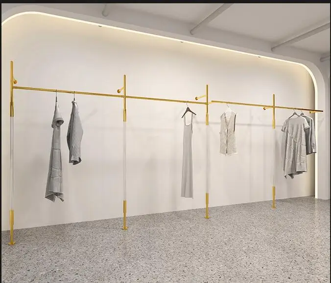 Women's clothing store stainless steel display rack golden clothes hanger acrylic column design landing Island shelf simple