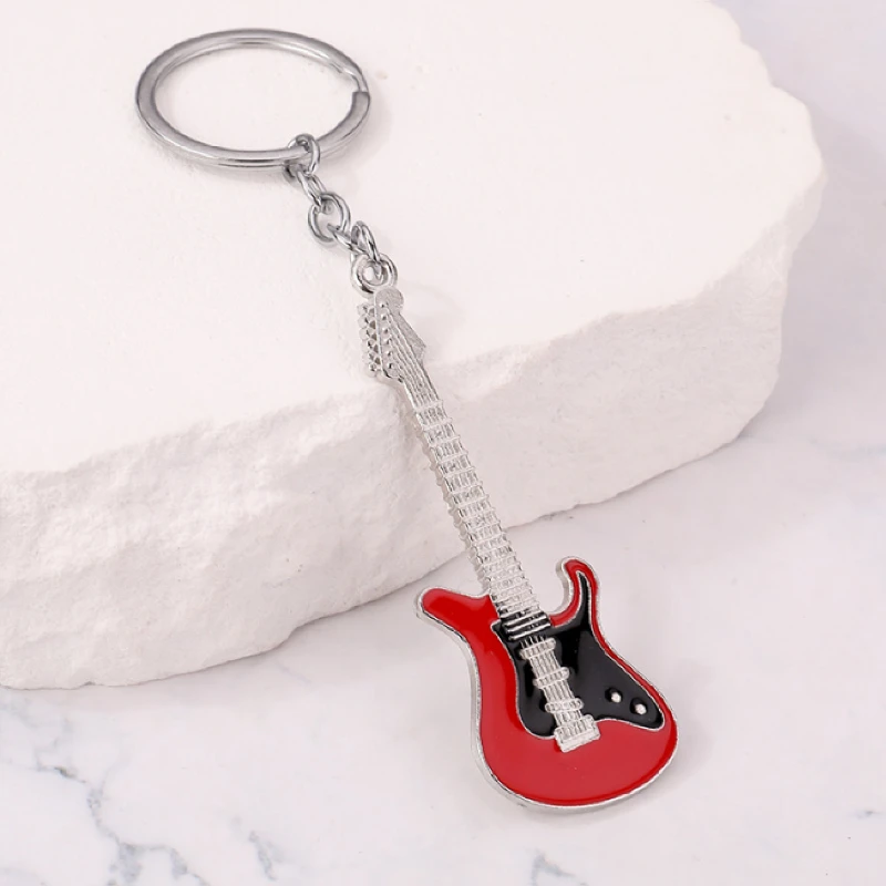 1pcs musical instrument pendant movable gift bag adorns guitar key ring