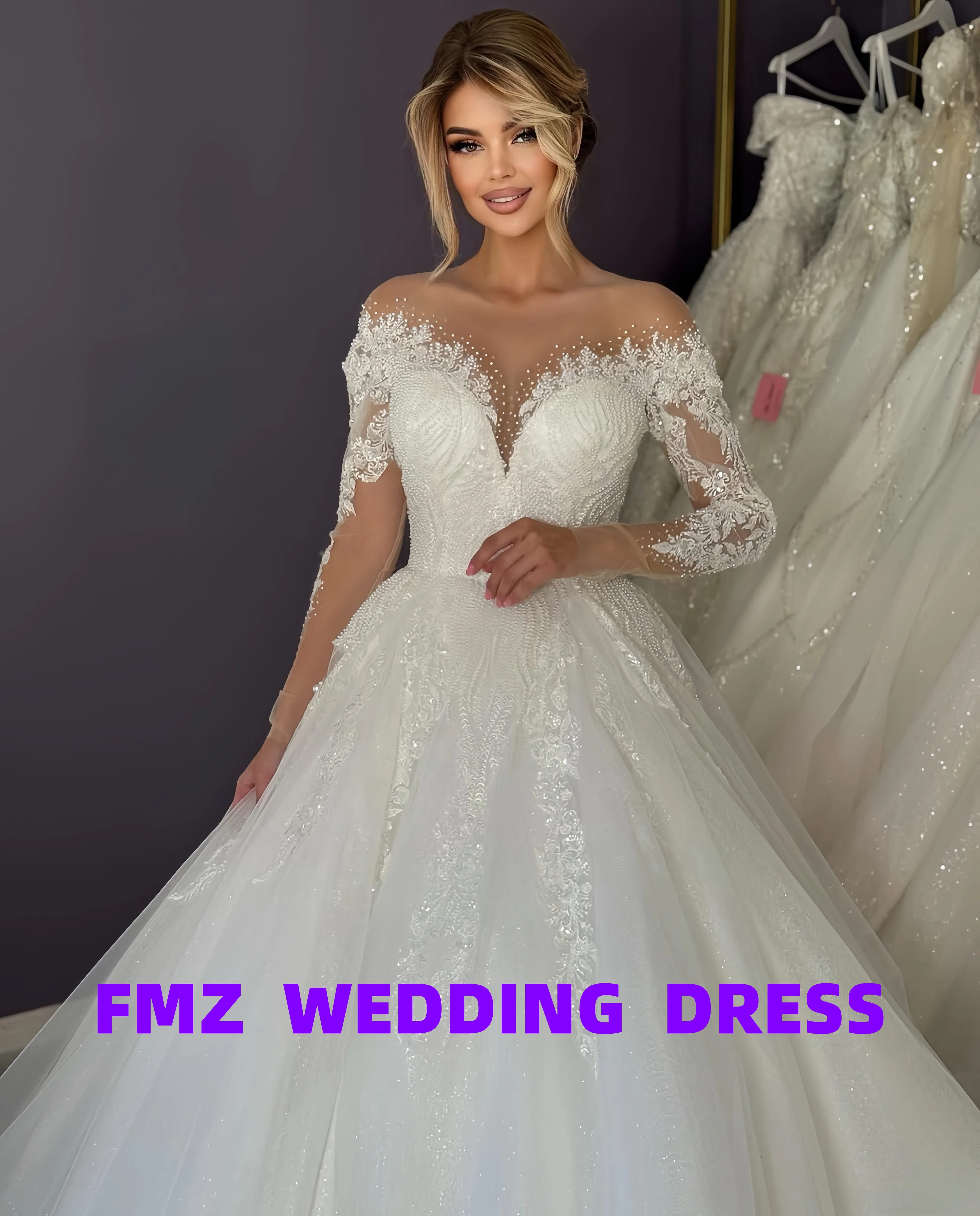 فستان زفاف أنيق بأكمام طويلة ورقبة على شكل حرف V مخصص من أماندا نوفيا فيستدوس دي نوفيا أماندا