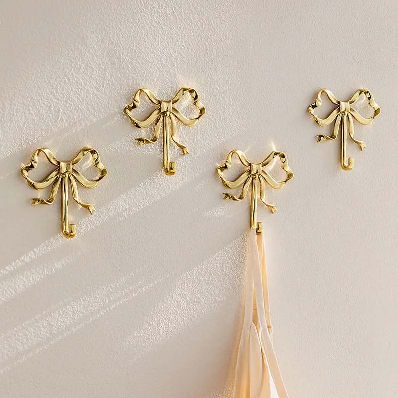 Luxury Brass Bow-Knot Hook Nordic Retro Clothes Hook Gold Bow Shape Wall Coat Hook Bedroom Porch Bathroom Wall Hangings 2024