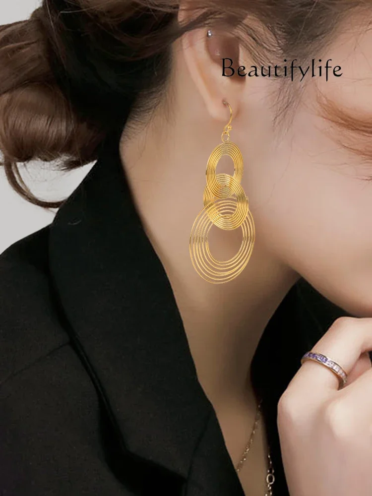 Multi-layer round hollow earrings, European and American long light luxury niche new temperament designer models