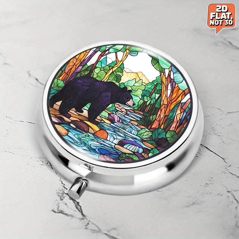 Portable round metal pill box, adorned with a vibrant stained glass pattern of a black bear by a forest stream, is perfect for storing medication, vitamins, and other small items. It can also be used for multi-functional storage of coins, travel and sports supplies, flat design