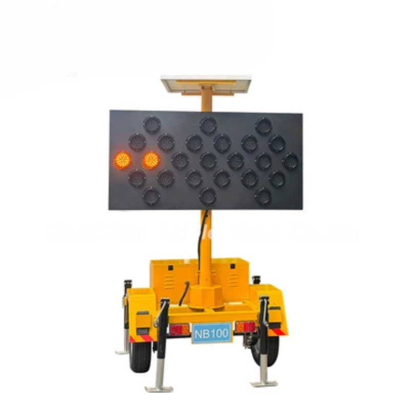 Guide signs with solar panels and battery carts direct traffic and ensure drivers