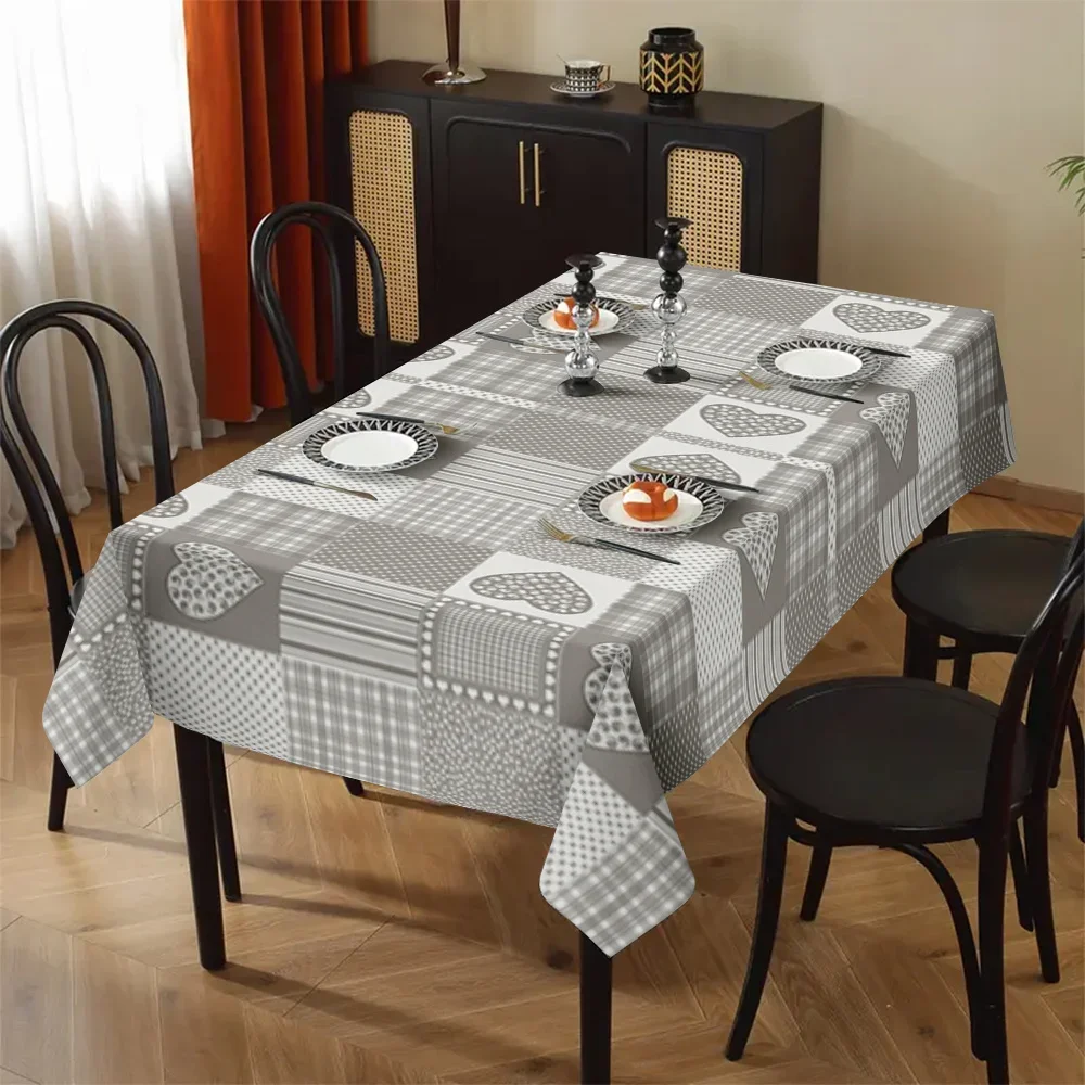One grey-toned patchwork polka dot tablecloth with a geometric design of hearts.