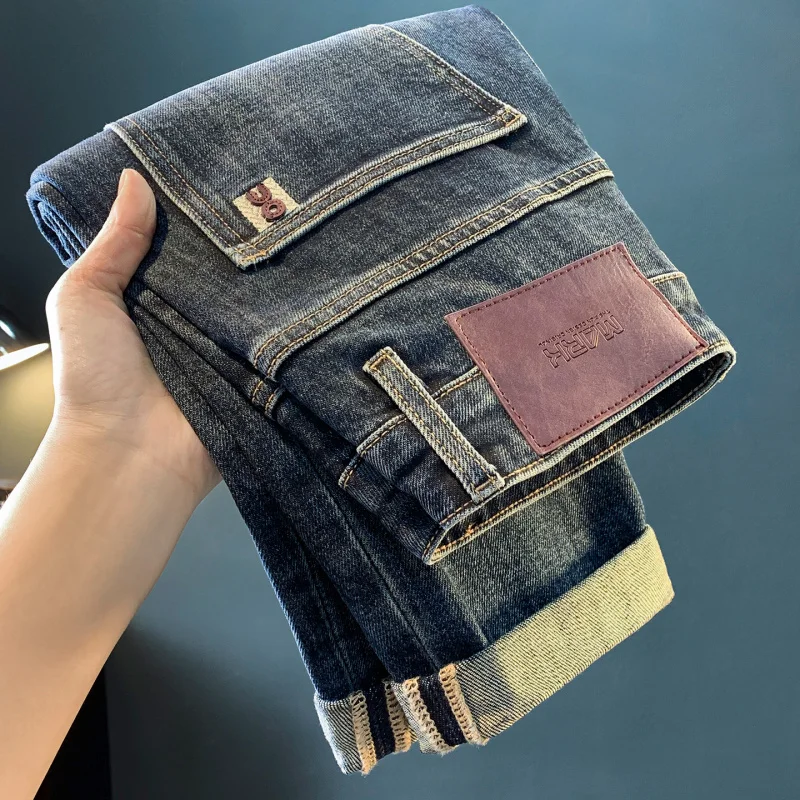 Men's jeans 2025 autumn new fashion high-end trend embroidered print loose tapered elastic pants men