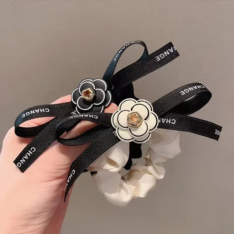 

High-quality Boutique Camellia Streamer Bow Hair Tie Ring Fat Intestine Elastic Ties for Women Wholesale Accesories