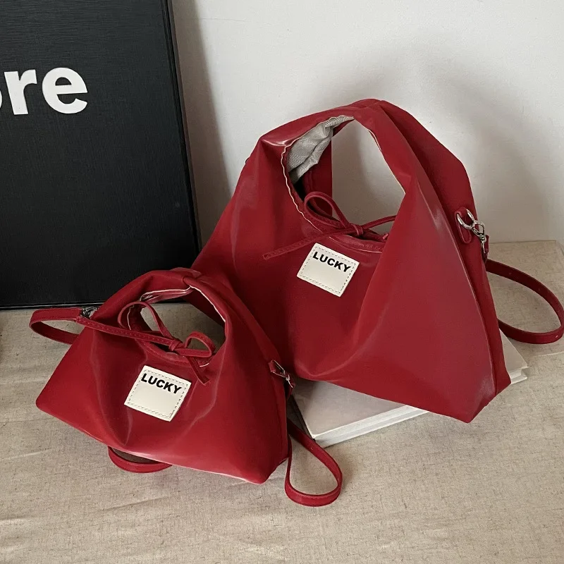 

2025 New! Women's Fashion-Forward Niche Dumpling Bag | Soft Leather Texture Portable Versatile Commuter Messenger