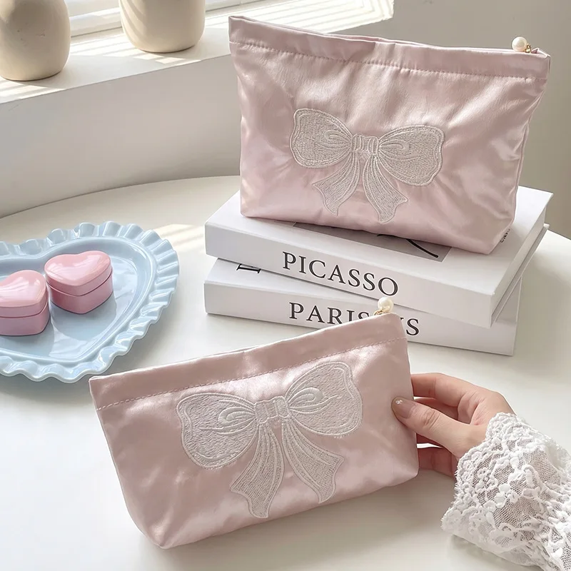 Pink satin embroidered bow cosmetic bag portable pearl zipper storage bag Korean portable cosmetic bag