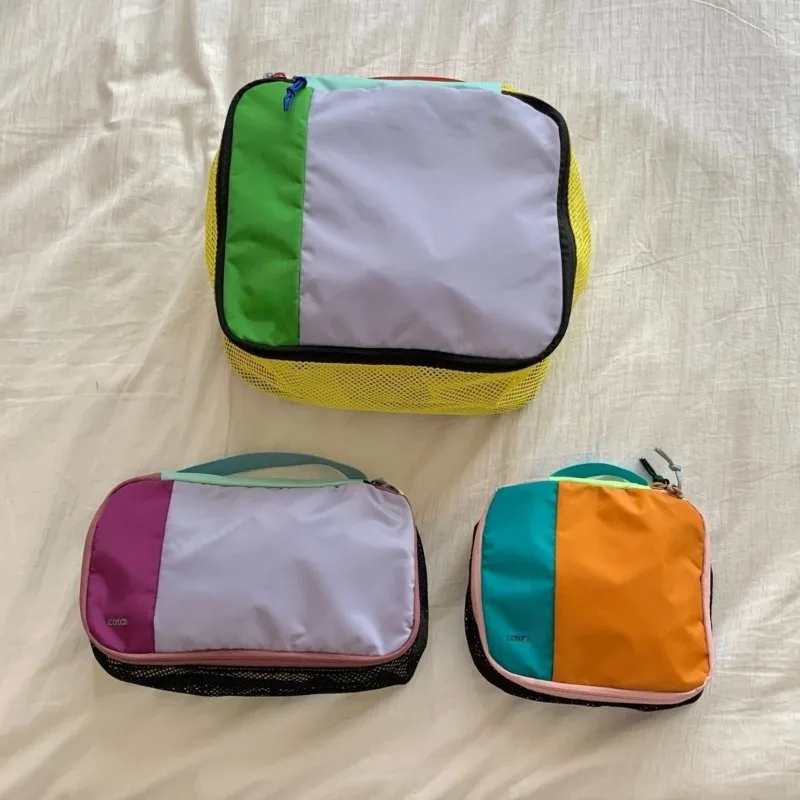2026 new color blocking waterproof set makeup bag, women's portable travel commuting storage bag, lightweight nylon wash bag