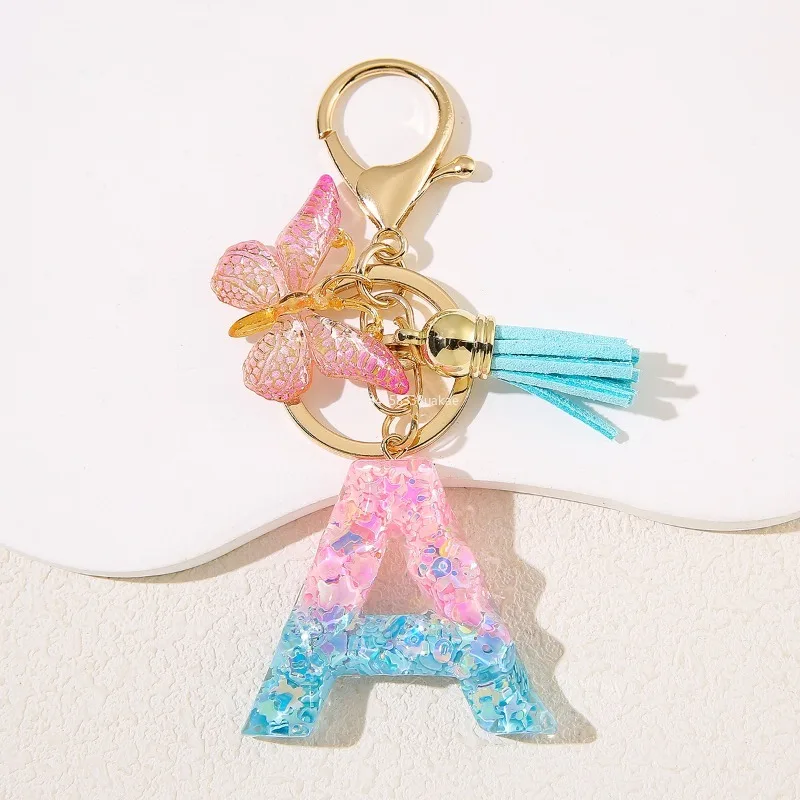 Llavero con letras de joyería de color rosa degradado, llavero con letras de resina con flecos y mariposa, decoración para bolso DIY, colgante, regalos de fiesta бneen