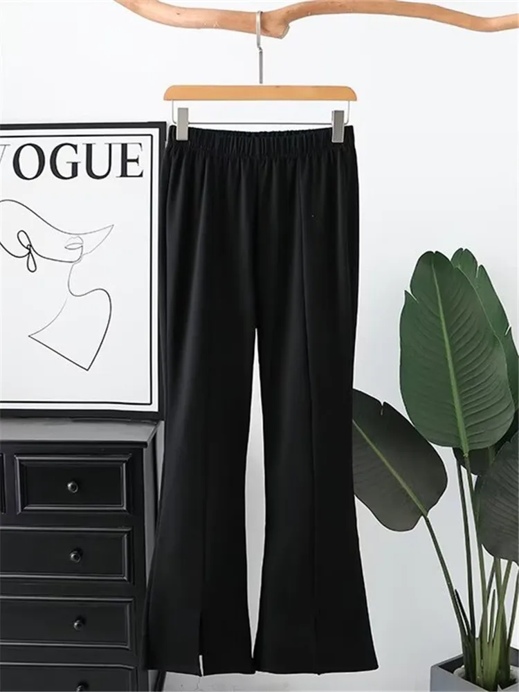 

Plus Size Women's Pants High Elastic Black Flared Pants With Elastic Waist The Trouser Legs With Slits At The Front On Bottom