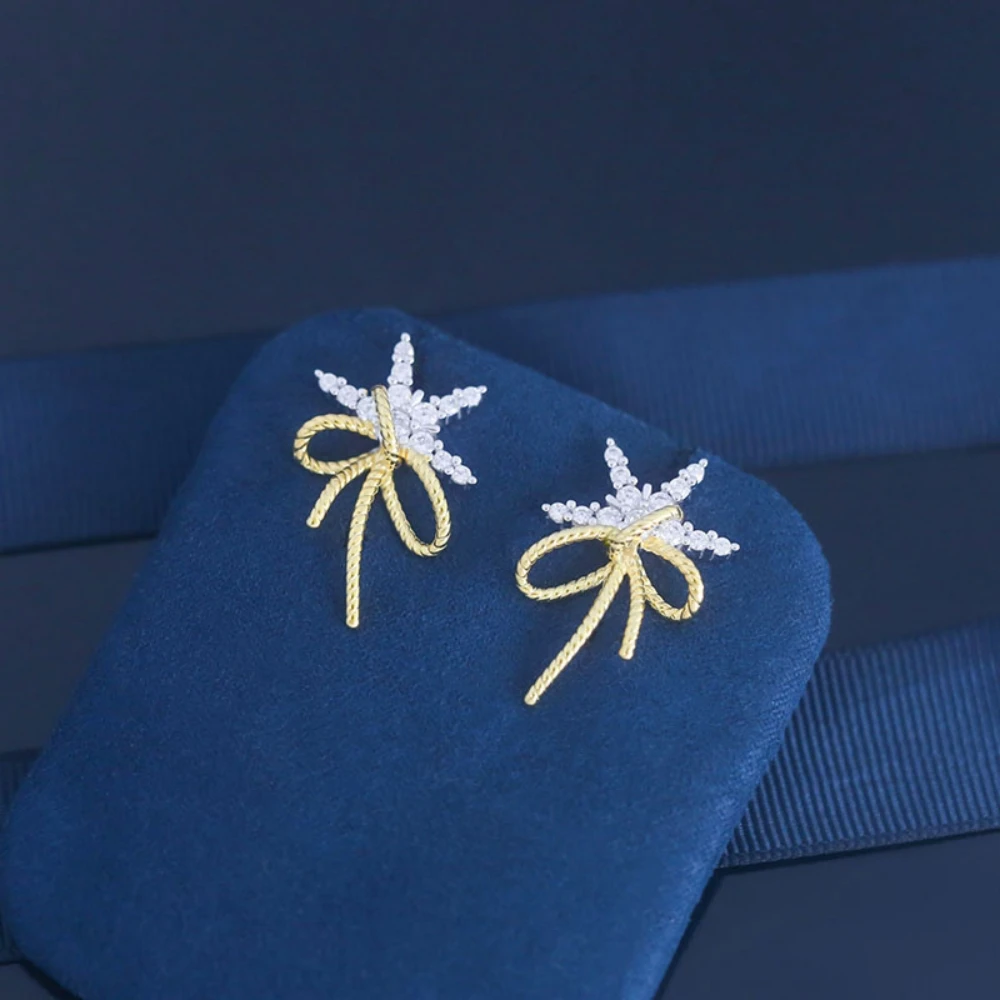 

2023 Hot Selling Snowflake Bow Ribbon Earrings Female Simple Temperament Personality Exquisite Fashion Earrings For Women