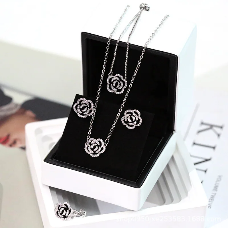 CARLIDANA 4pcs/Set Luxury Camellia Drop Oil Necklace/Earrings/Ring/Bracelet Gold/Silver Color for Woman Jewelry Gift Wholesale