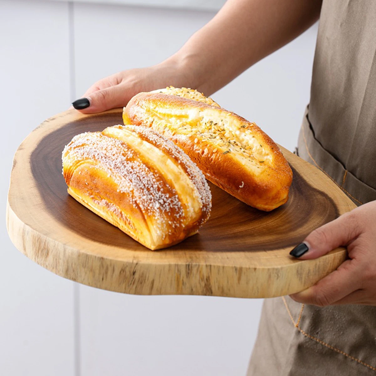 Irregular shape cutting board for bread and fruit, made from a single piece of rosewood