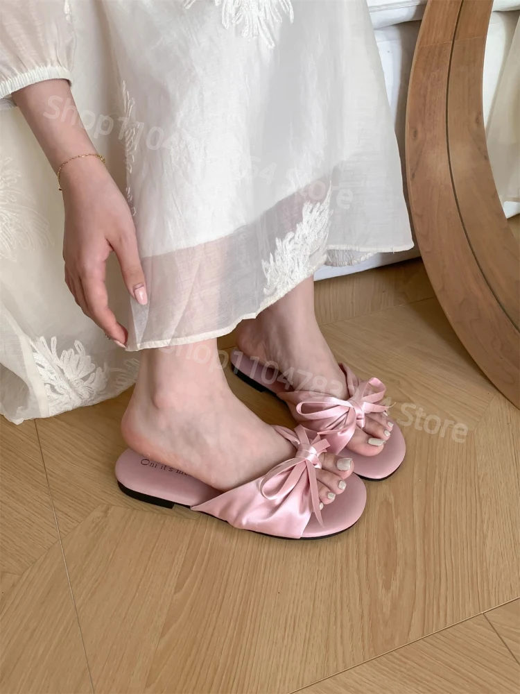 عقدة الصنادل المسطحة المرأة الصيف ملابس خارجية 2025 جديد الجنية مطابقة التنانير نعال شاطئ الكورية Sle كعب منخفض #2